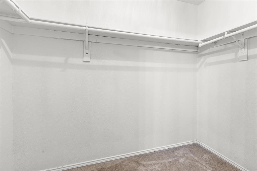 3521 Apple Valley Way Dallas, TX 75227 - Photo 13 of 25 a view of an empty walk in closet