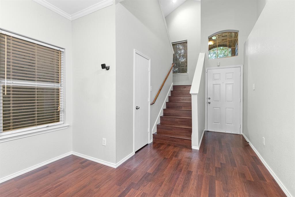 3521 Apple Valley Way Dallas, TX 75227 - Photo 14 of 25 a view of a hallway with wooden floor and entryway