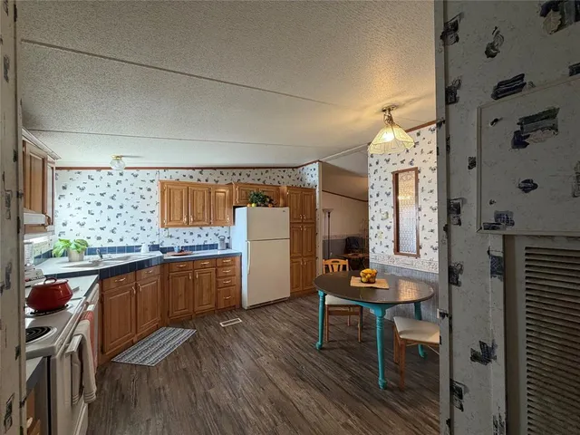 a room with wooden floor and furniture