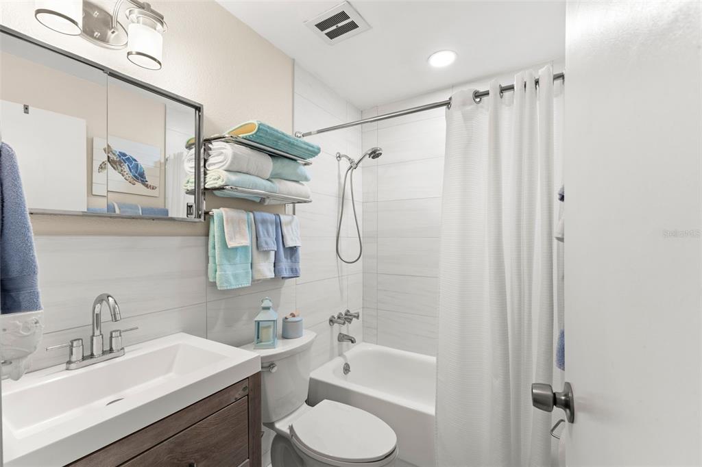 2461 Canadian Way, Unit 27 Clearwater, FL 33763 - Photo 12 of 35 a bathroom with a sink toilet tub and shower