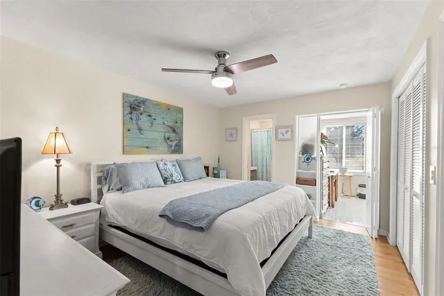 a bedroom with a bed and a tv