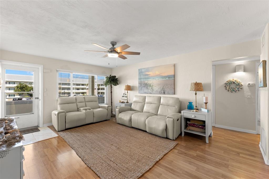 2461 Canadian Way, Unit 27 Clearwater, FL 33763 - Photo 23 of 35 a living room with furniture and a large window