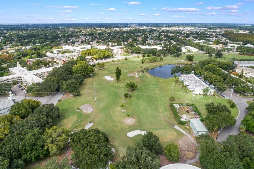 2461 Canadian Way, Unit 27 Clearwater, FL 33763 - Photo 34 of 35 an aerial view of residential houses with outdoor space