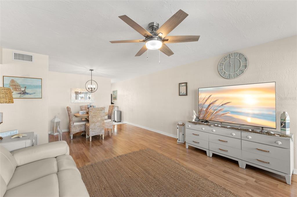 2461 Canadian Way, Unit 27 Clearwater, FL 33763 - Photo 7 of 35 a living room with furniture and a flat screen tv