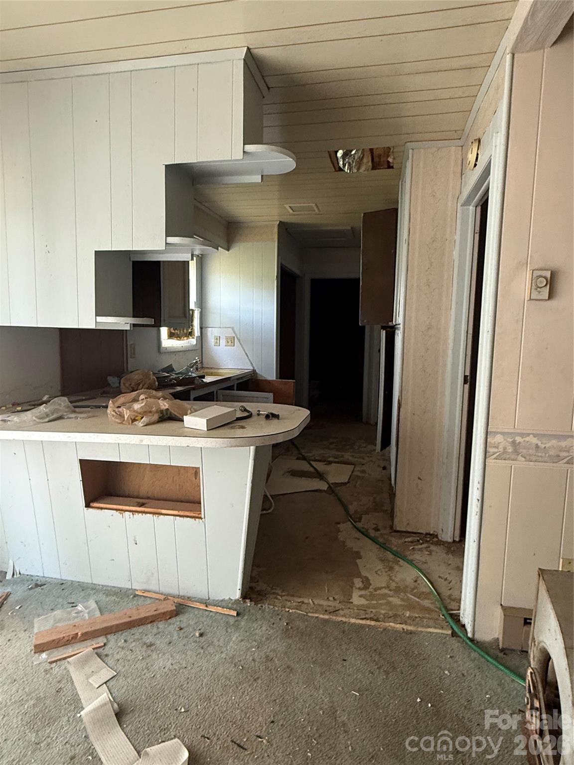 370 Rock Grove Church Road Rockwell, NC 28138 - Photo 28 of 34 a kitchen with a stove and a refrigerator