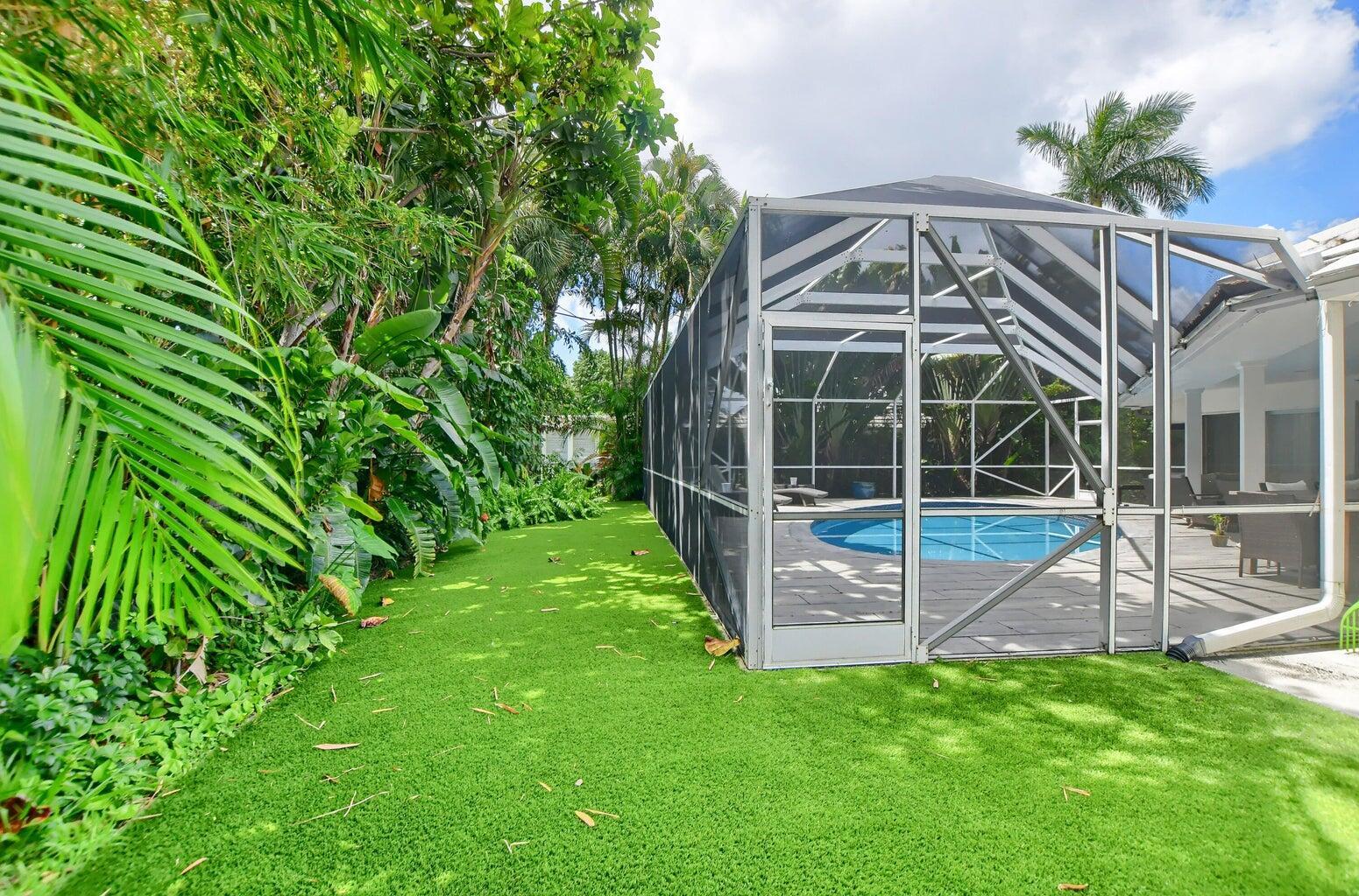 880 Hickory Terrace Boca Raton, FL 33486 - Photo 34 of 38 a view of a house with a backyard