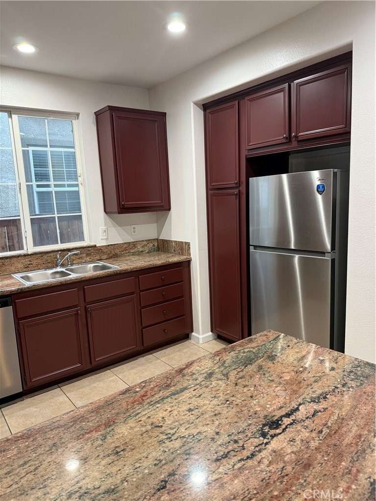 26015 Reed Way Loma Linda, CA 92354 - Photo 13 of 15 a kitchen with a refrigerator and a sink