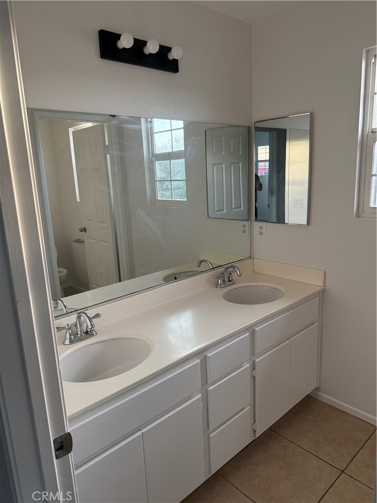 26015 Reed Way Loma Linda, CA 92354 - Photo 3 of 15 a bathroom with a sink and a mirror