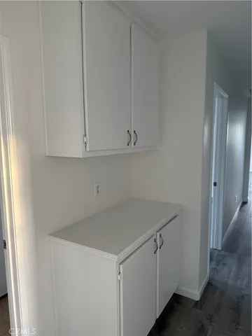 a utility room with cabinets