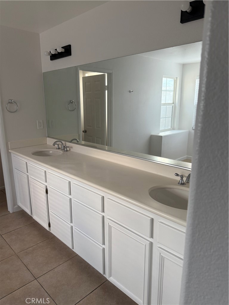 26015 Reed Way Loma Linda, CA 92354 - Photo 6 of 15 a bathroom with a sink and a mirror