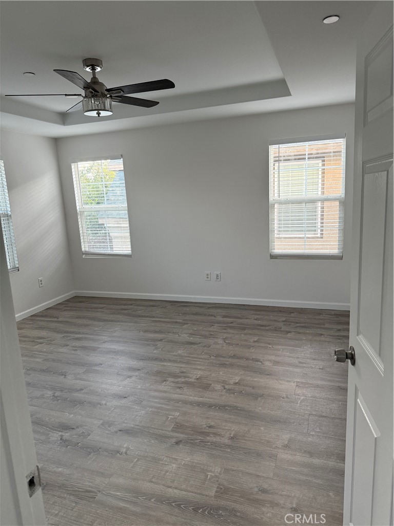 26015 Reed Way Loma Linda, CA 92354 - Photo 8 of 15 an empty room with a ceiling fan and window