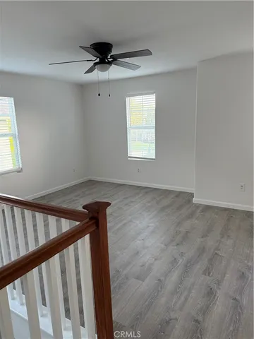 a view of a hallway with a window
