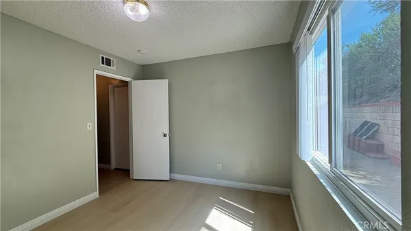 a view of hallway with a large window and stairs