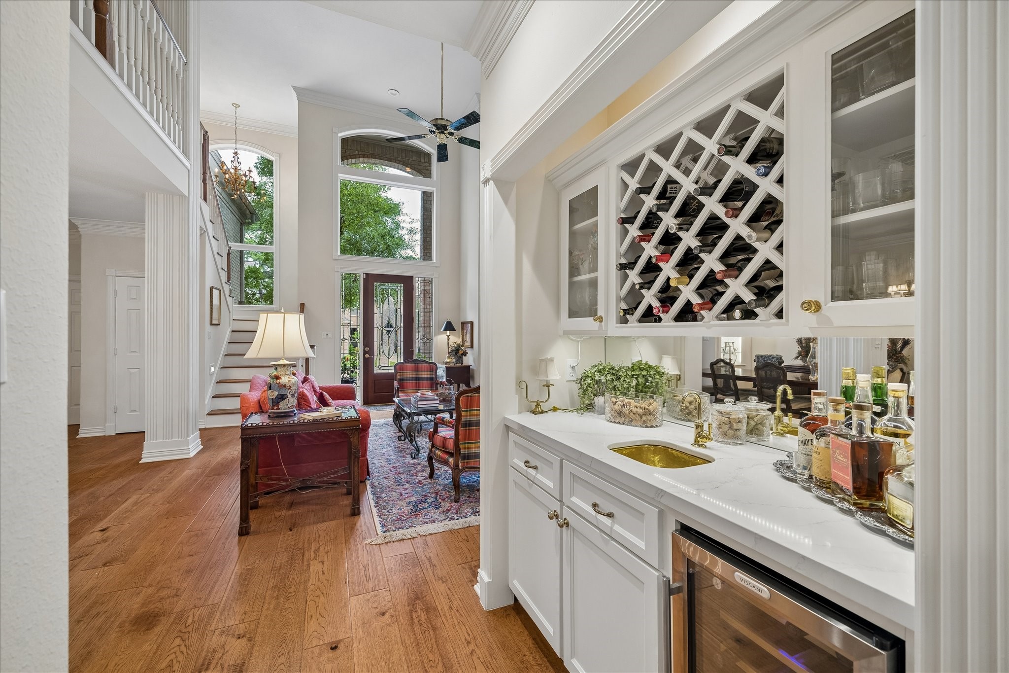 6611 Trebeck Lane Spring, TX 77379 - Photo 11 of 33 Well-appointed serving area connects seamlessly to the main living spaces, adding both convenience and elevated style for hosting.