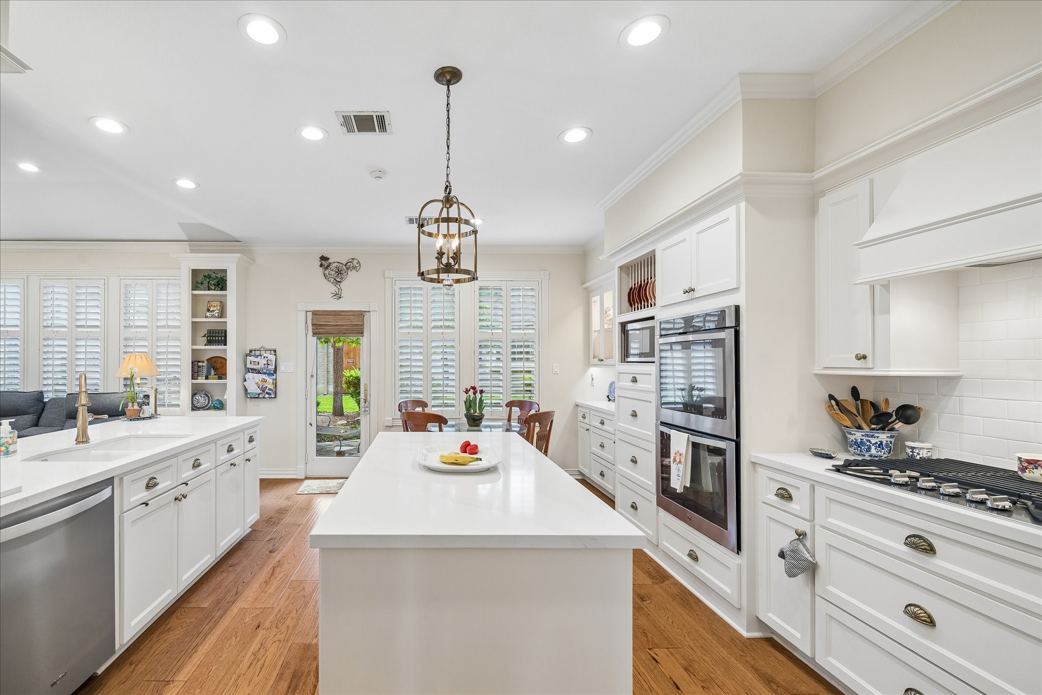 6611 Trebeck Lane Spring, TX 77379 - Photo 17 of 33 Spacious island kitchen with ample prep space, custom cabinetry, and designer lighting, offering both function and timeless style.