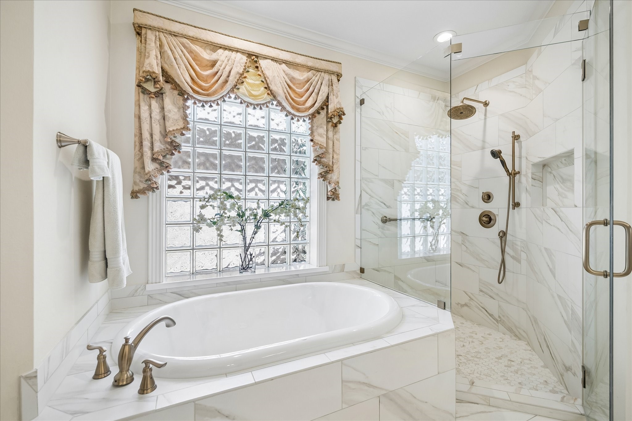 6611 Trebeck Lane Spring, TX 77379 - Photo 20 of 33 Luxurious soaking tub and oversized walk-in shower with seamless glass and designer tile create a relaxing, retreat-like experience.