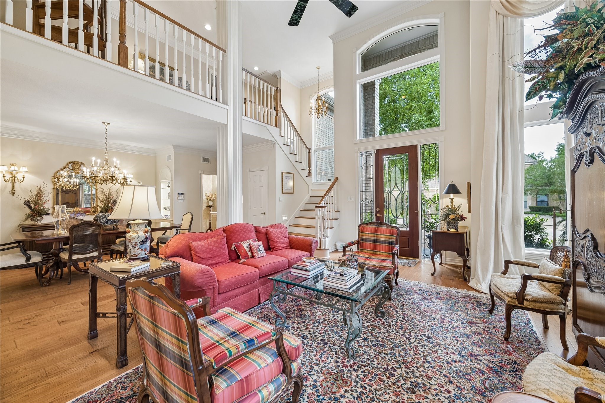 6611 Trebeck Lane Spring, TX 77379 - Photo 2 of 33 Dramatic two-story entry opens to the formal living area, highlighted by grand columns, elegant staircase, and expansive windows that fill the home with natural light.