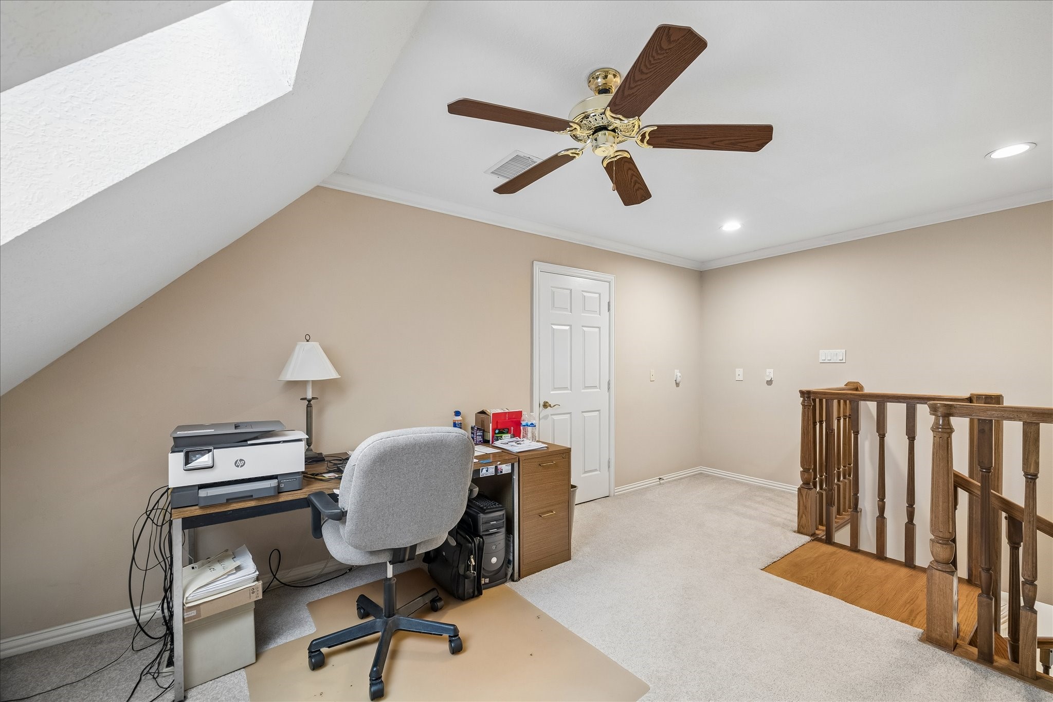 6611 Trebeck Lane Spring, TX 77379 - Photo 23 of 33 At the top of the spiral stairs, you'll find a versatile loft area ideal for a home office, study nook, or recharge zone.