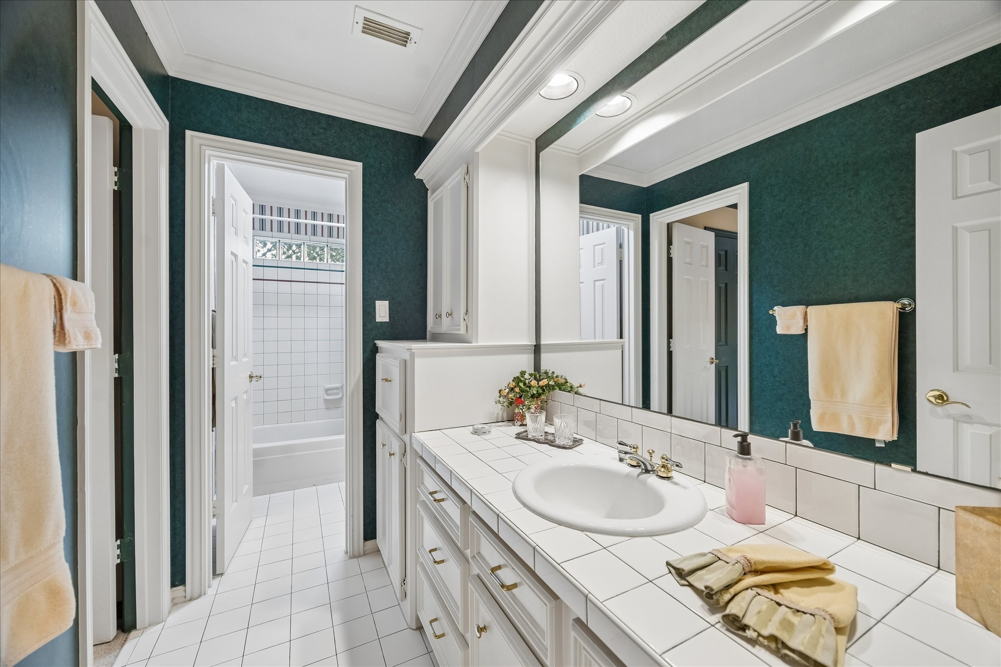 6611 Trebeck Lane Spring, TX 77379 - Photo 26 of 33 Secondary bath with generous storage and crown molding.