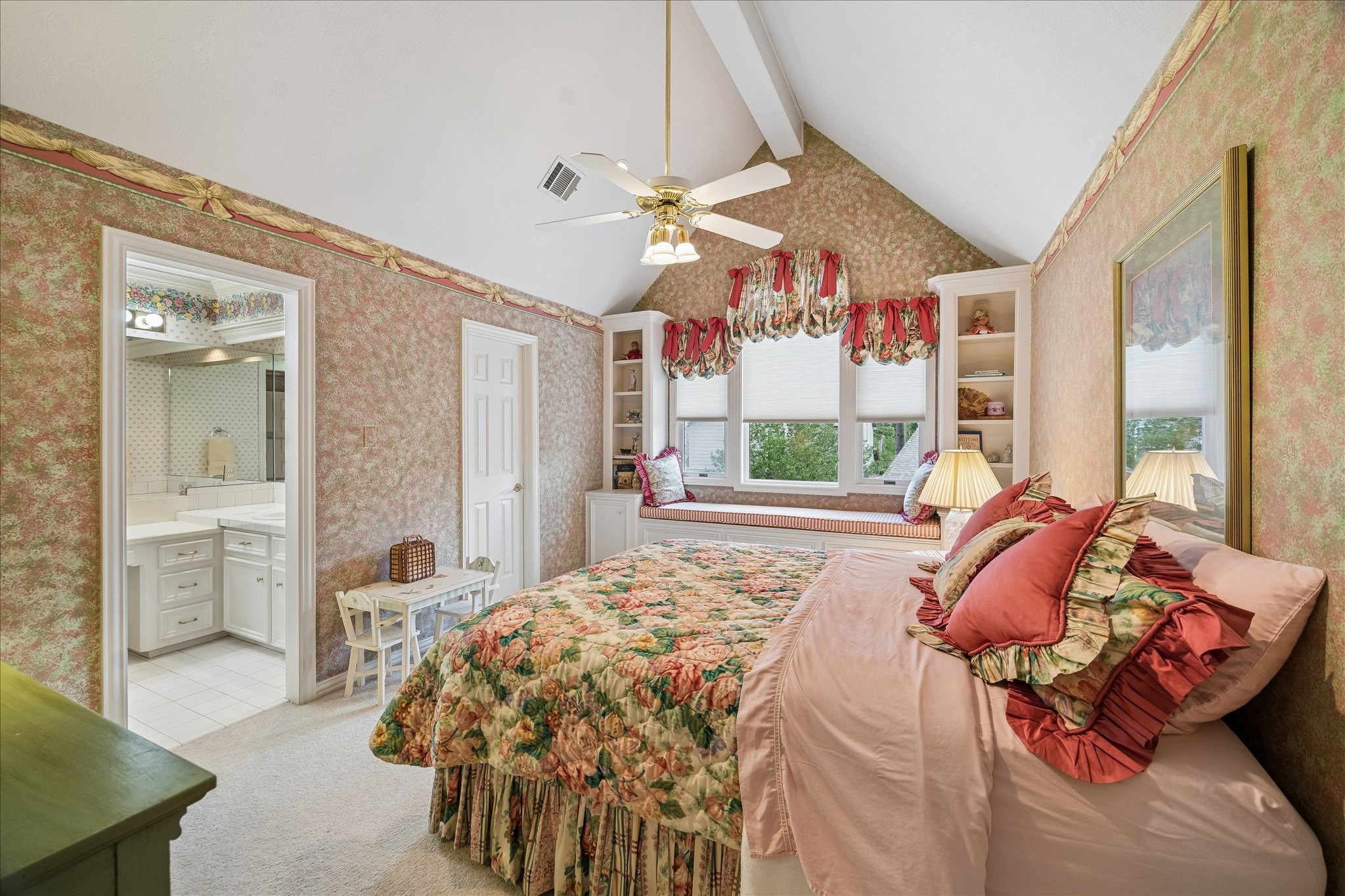 6611 Trebeck Lane Spring, TX 77379 - Photo 27 of 33 Spacious secondary bedroom with vaulted ceilings, built-in window seating, and en-suite bath access.