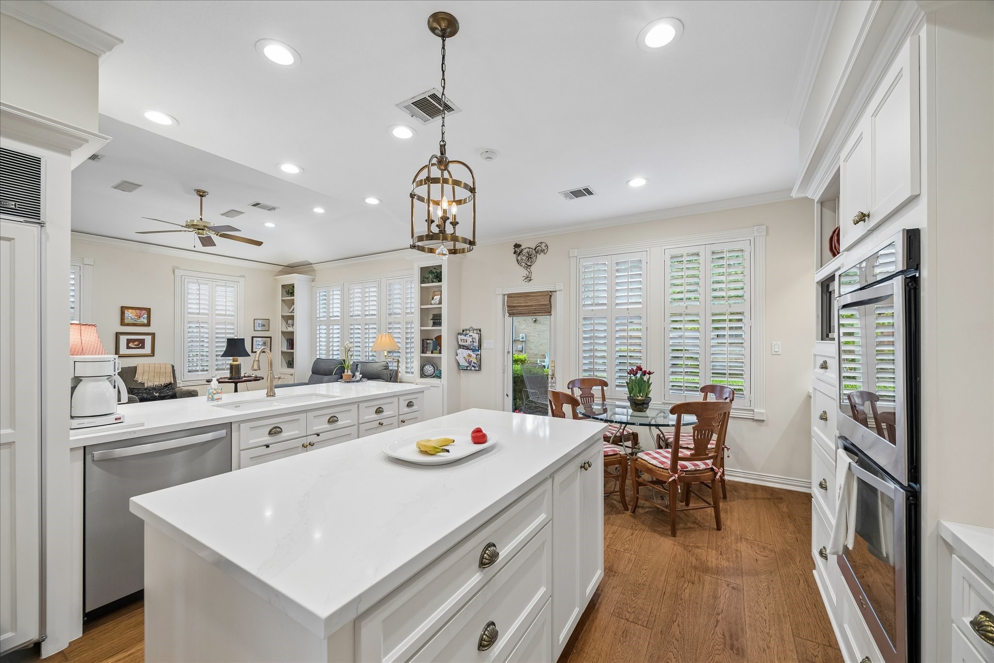 6611 Trebeck Lane Spring, TX 77379 - Photo 3 of 33 Bright, beautifully updated kitchen with crisp cabinetry, quartz countertops, and a large island, opening to a charming breakfast area with backyard views.
