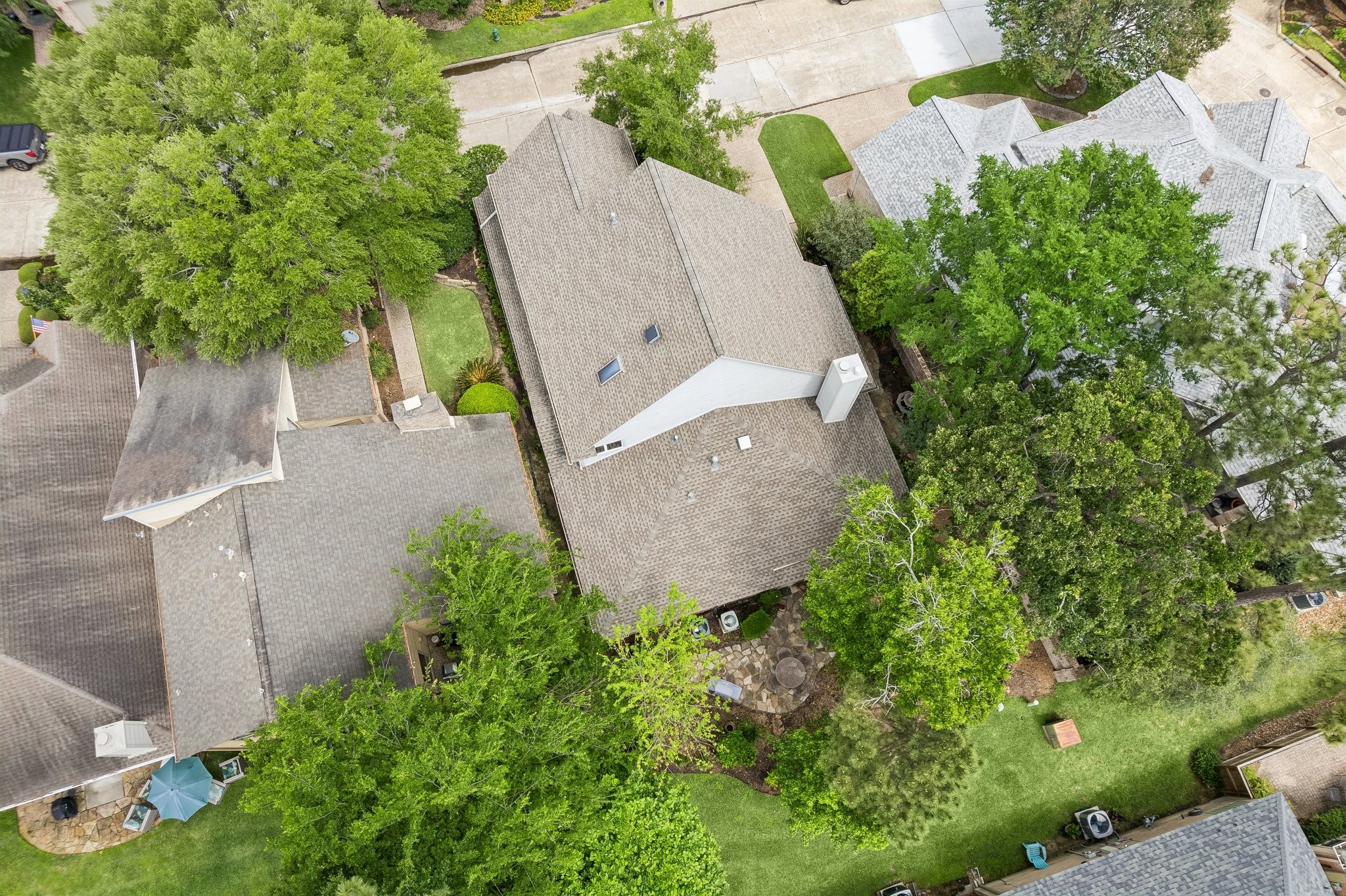 6611 Trebeck Lane Spring, TX 77379 - Photo 32 of 33 Expansive roofline and well-positioned layout highlight the home’s generous footprint, with mature trees providing natural shade and privacy.