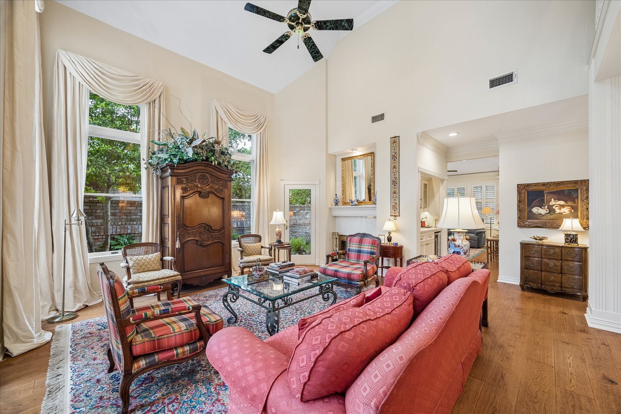 6611 Trebeck Lane Spring, TX 77379 - Photo 7 of 33 Oversized Anderson windows frame serene backyard views while enhancing the open, airy feel of this beautifully designed living space.