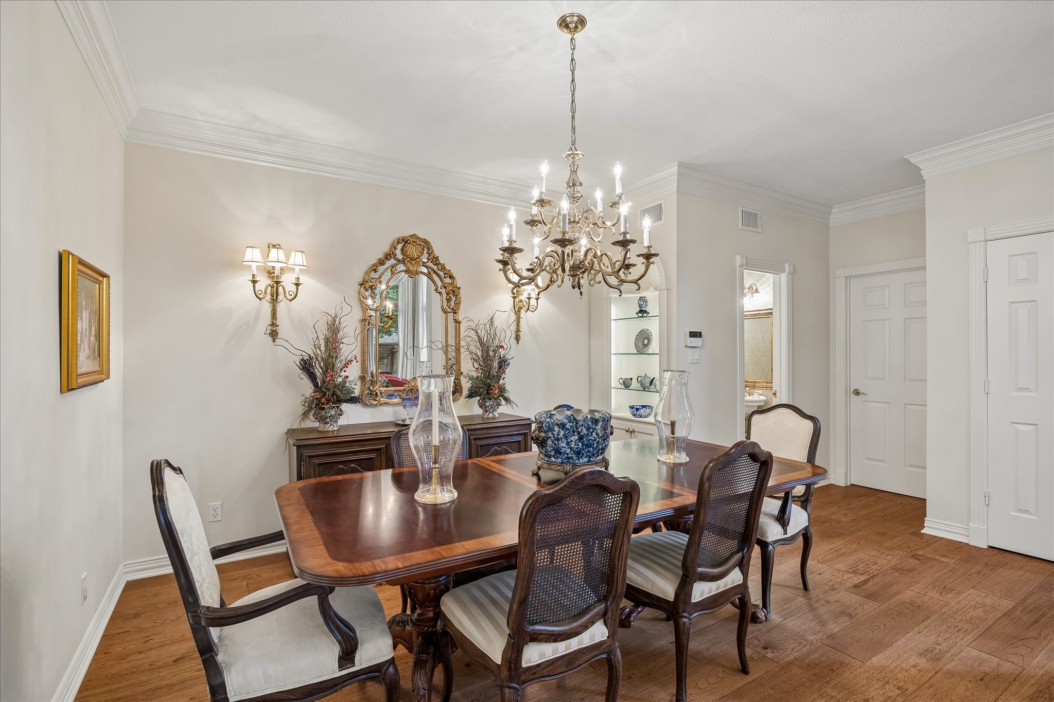 6611 Trebeck Lane Spring, TX 77379 - Photo 8 of 33 Elegant formal dining room with crown molding, perfect for hosting gatherings and special occasions.