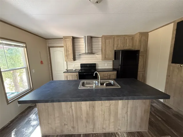 a living room with furniture wooden floor and a table