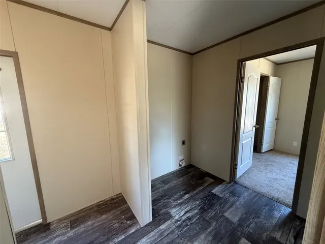 a view of a bathroom with wooden floor