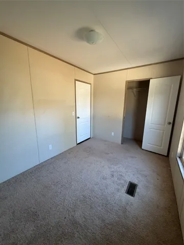 a view of an empty room with a glass door