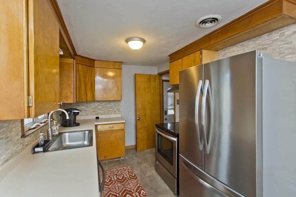31 Fitzgerald Road Springfield, MA 01104 - Photo 15 of 41 a kitchen with stainless steel appliances a refrigerator and a sink