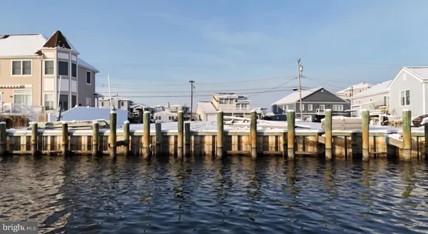 a view of a swimming pool and outdoor seating