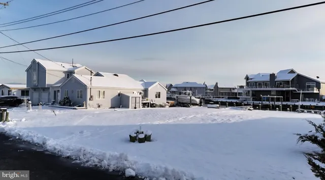 a view of multiple houses with a city
