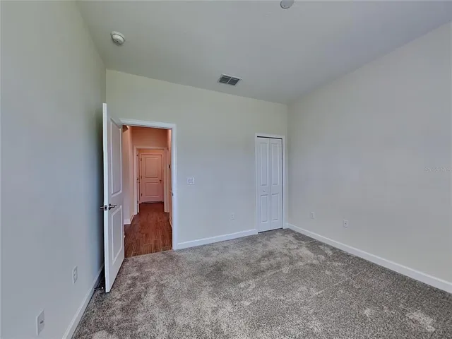 a view of a room with a hallway