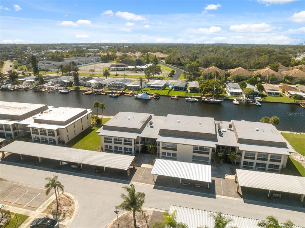 4812 Jasper Drive, Unit 105 New Port Richey, FL 34652 - Photo 1 of 63 an aerial view of residential houses with outdoor space