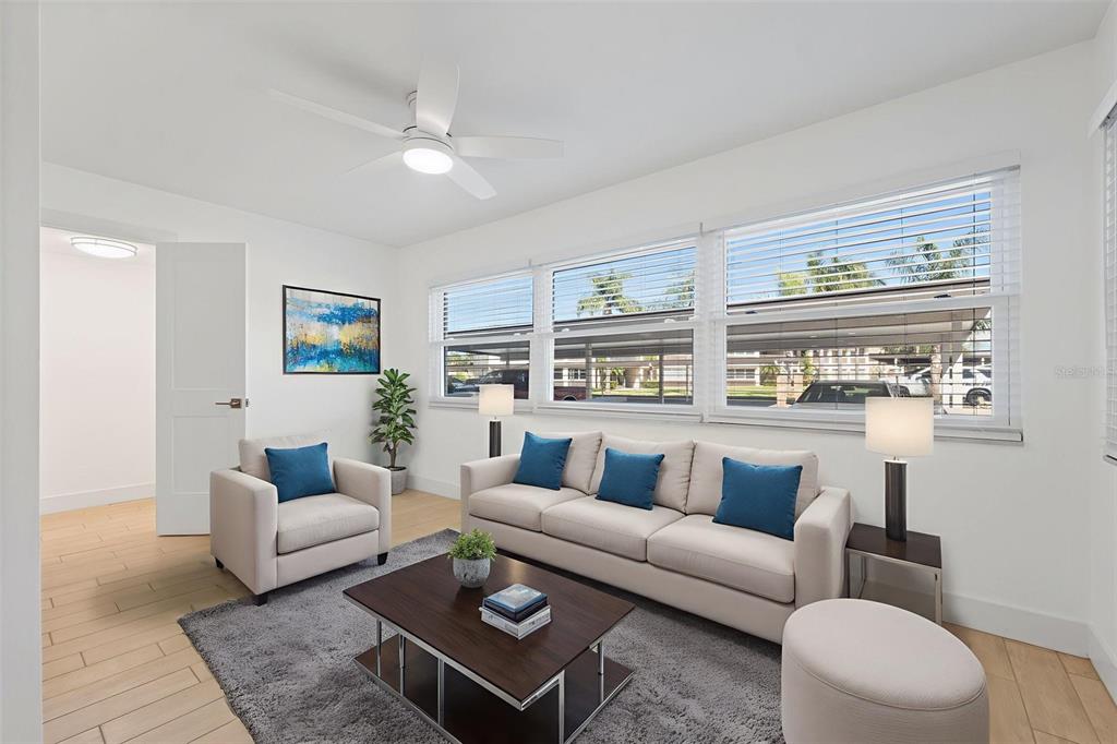4812 Jasper Drive, Unit 105 New Port Richey, FL 34652 - Photo 16 of 63 a living room with furniture and a table