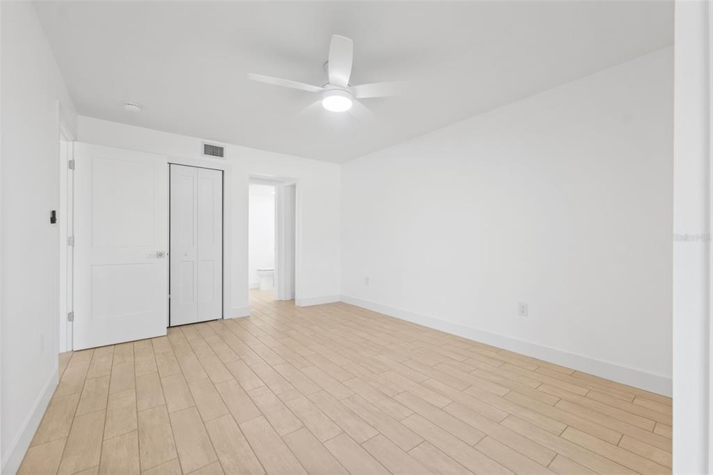 4812 Jasper Drive, Unit 105 New Port Richey, FL 34652 - Photo 25 of 63 a view of an empty room with wooden floor