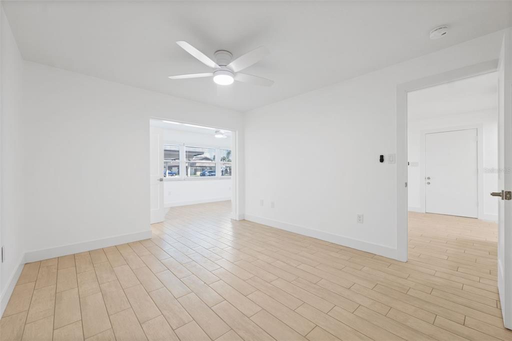 4812 Jasper Drive, Unit 105 New Port Richey, FL 34652 - Photo 27 of 63 wooden floor in an empty room