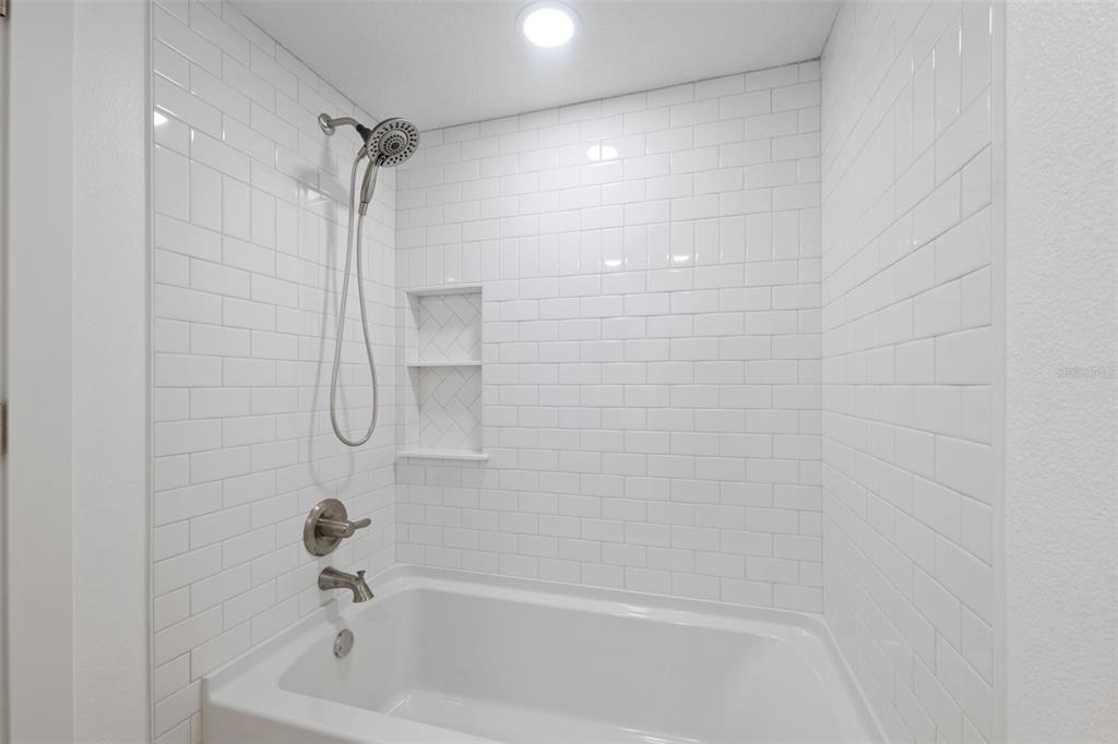 4812 Jasper Drive, Unit 105 New Port Richey, FL 34652 - Photo 29 of 63 a bathroom with a bathtub