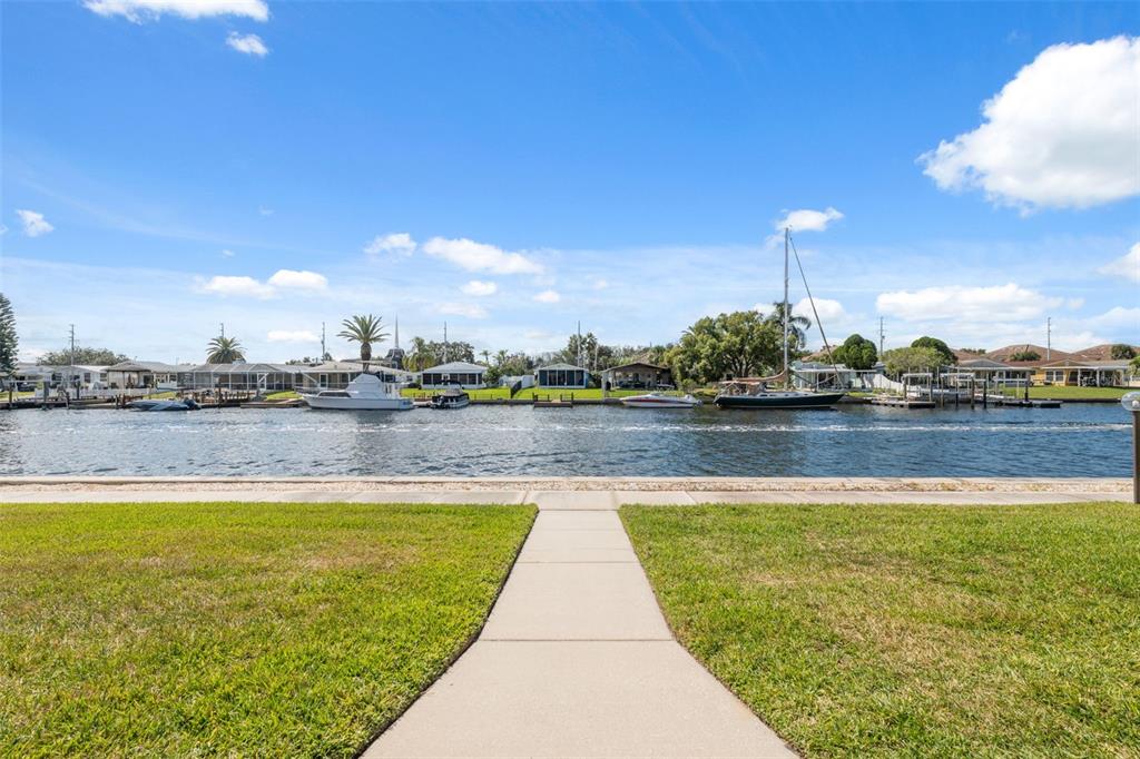 4812 Jasper Drive, Unit 105 New Port Richey, FL 34652 - Photo 30 of 63 a view of a lake with a city