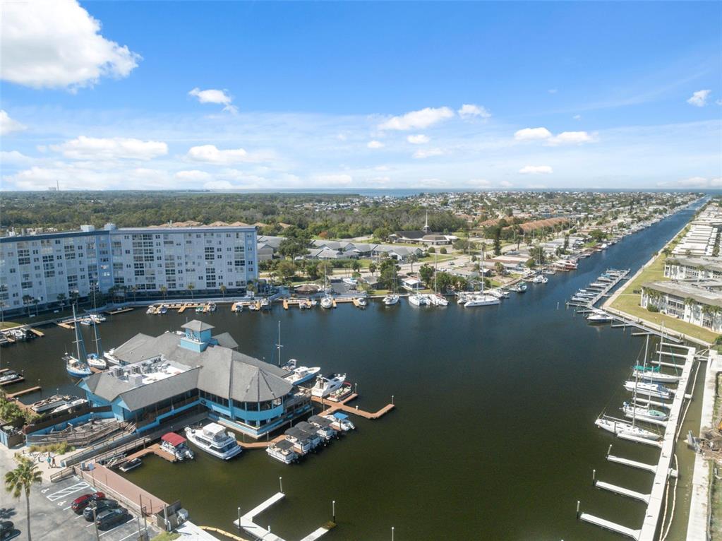 4812 Jasper Drive, Unit 105 New Port Richey, FL 34652 - Photo 47 of 63 an aerial view of a house with a lake view