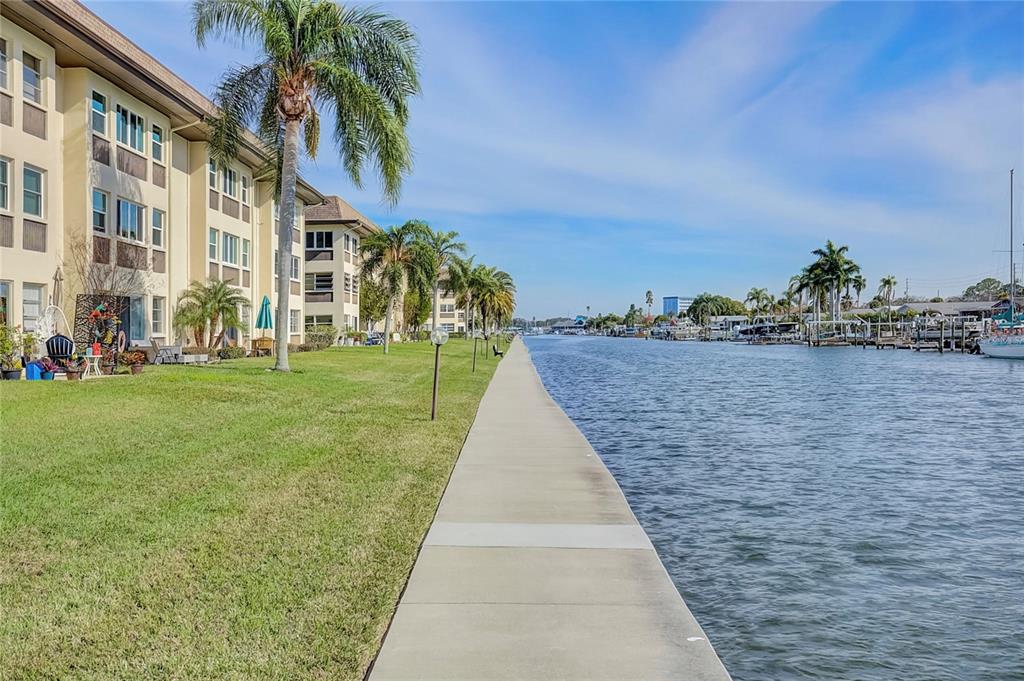 4812 Jasper Drive, Unit 105 New Port Richey, FL 34652 - Photo 56 of 63 a view of a pathway with a yard