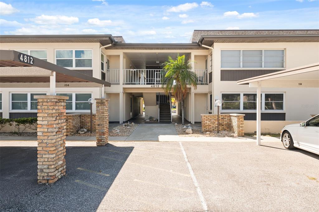 4812 Jasper Drive, Unit 105 New Port Richey, FL 34652 - Photo 7 of 63 front view of a brick house with a patio
