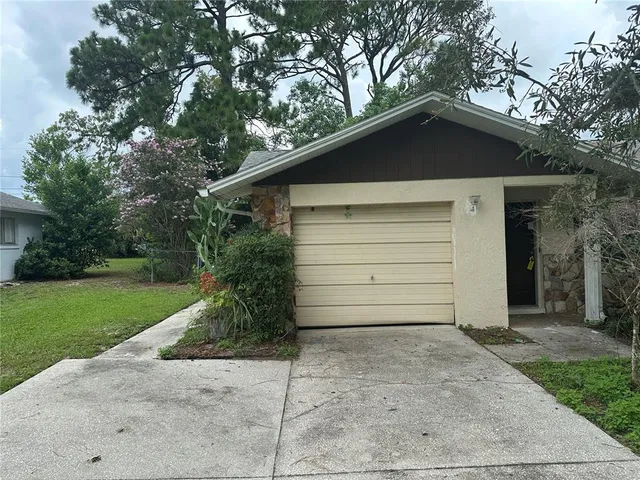 a small white house with a outdoor space