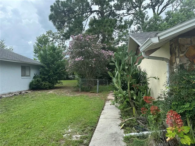 a backyard of a house with lots of green space