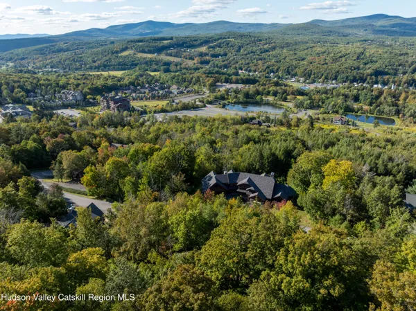 an aerial view of residential house and outdoor space