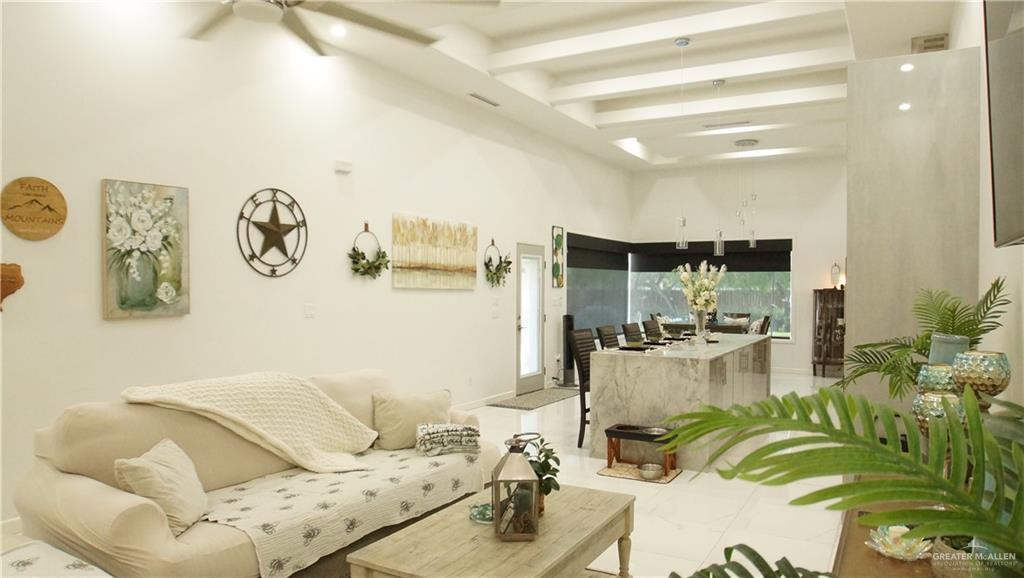 414 Ric Mar Street Edinburg, TX 78541 - Photo 27 of 36 Open-concept living area featuring high vaulted ceilings with exposed beams, recessed lighting, and a ceiling fan