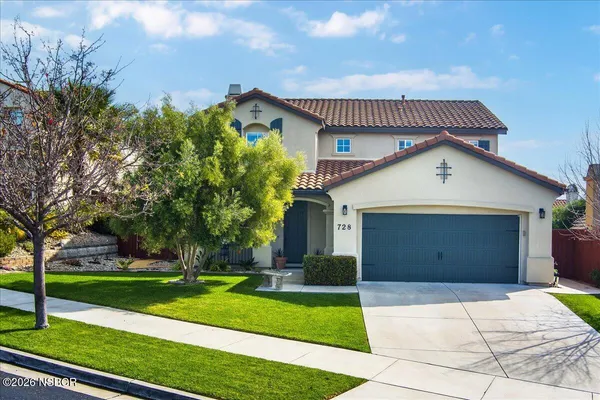 a view of a house with yard and tree s