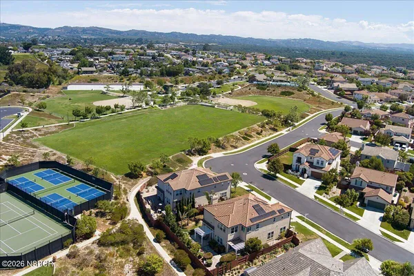 an aerial view of a house with a ocean view
